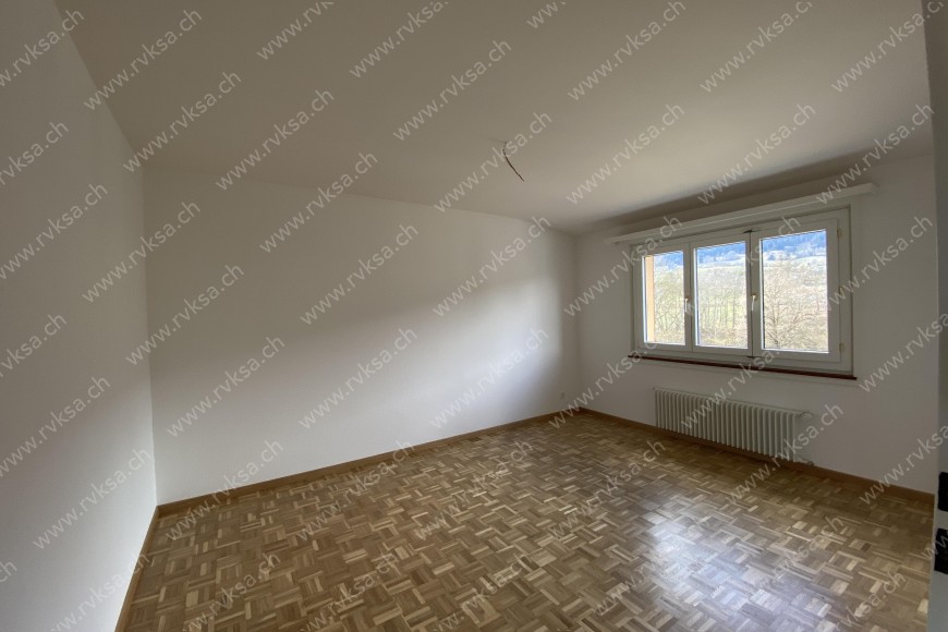 Appartement de 3 pièces, 83 m2, à Coffrane - Chambre N°1 